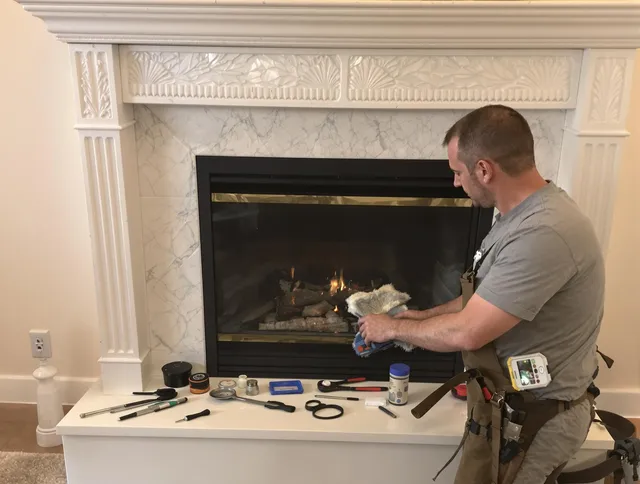 Duxbury Chimney Sweep performing fireplace maintenance in Duxbury, MA